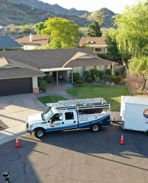 Sunny Energy service truck parked outside an Arizona home